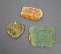 A Chinese jadeite lock pendant, dragon and a phoenix carving and a cash pendant