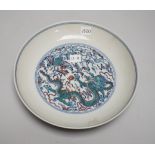 A Chinese doucai dish hand painted with a dragon chasing the flaming pearl, housed in a fitted case,
