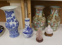 A pair of Chinese Canton decorated famille rose enamelled vases, 36cm high, an early 20th century