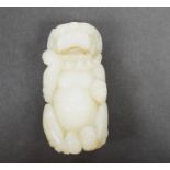 A Chinese white jade lion dog, 7cm
