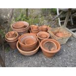 A quantity of assorted terracotta garden pots, largest diameter 36cm, height 33cm