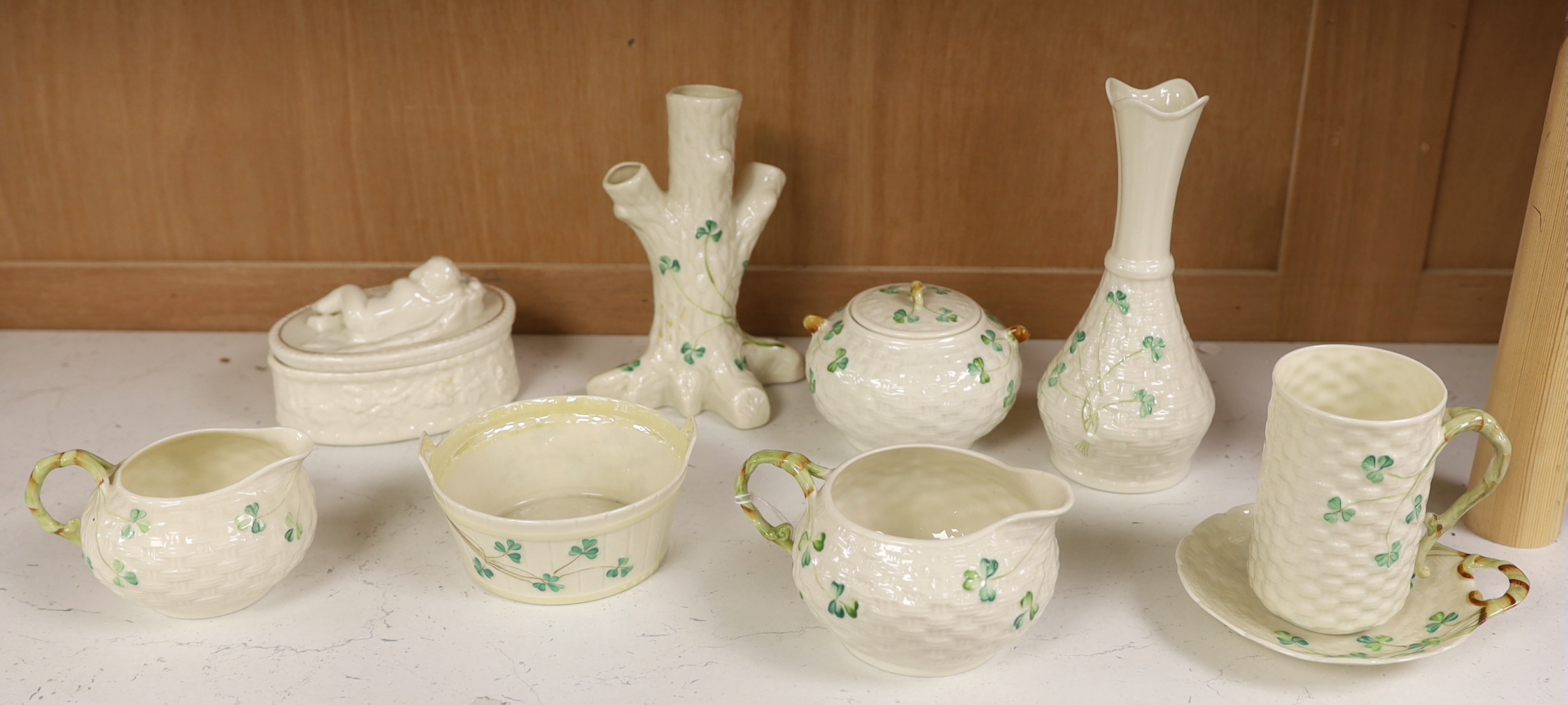A quantity of Belleek ‘Clover’ pattern ceramics and a Belleek box and cover, tallest 18.5cm