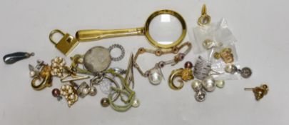 A quantity of costume jewellery including a yellow metal cufflink etc.
