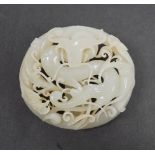 A 17th/18th century Chinese white jade ‘dragon’ belt buckle, 7cm