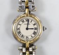 A lady's steel and gold Cartier Panthere quartz wrist watch, with Roman dial, case diameter 24mm, on