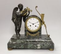 An early 19th century French ormolu and marble mantel clock in the form of Apollo, the enamel dial