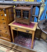 An Arts & Crafts rectangular oak writing / card table with hinged swivel top, width 76cm, depth