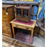 An Arts & Crafts rectangular oak writing / card table with hinged swivel top, width 76cm, depth