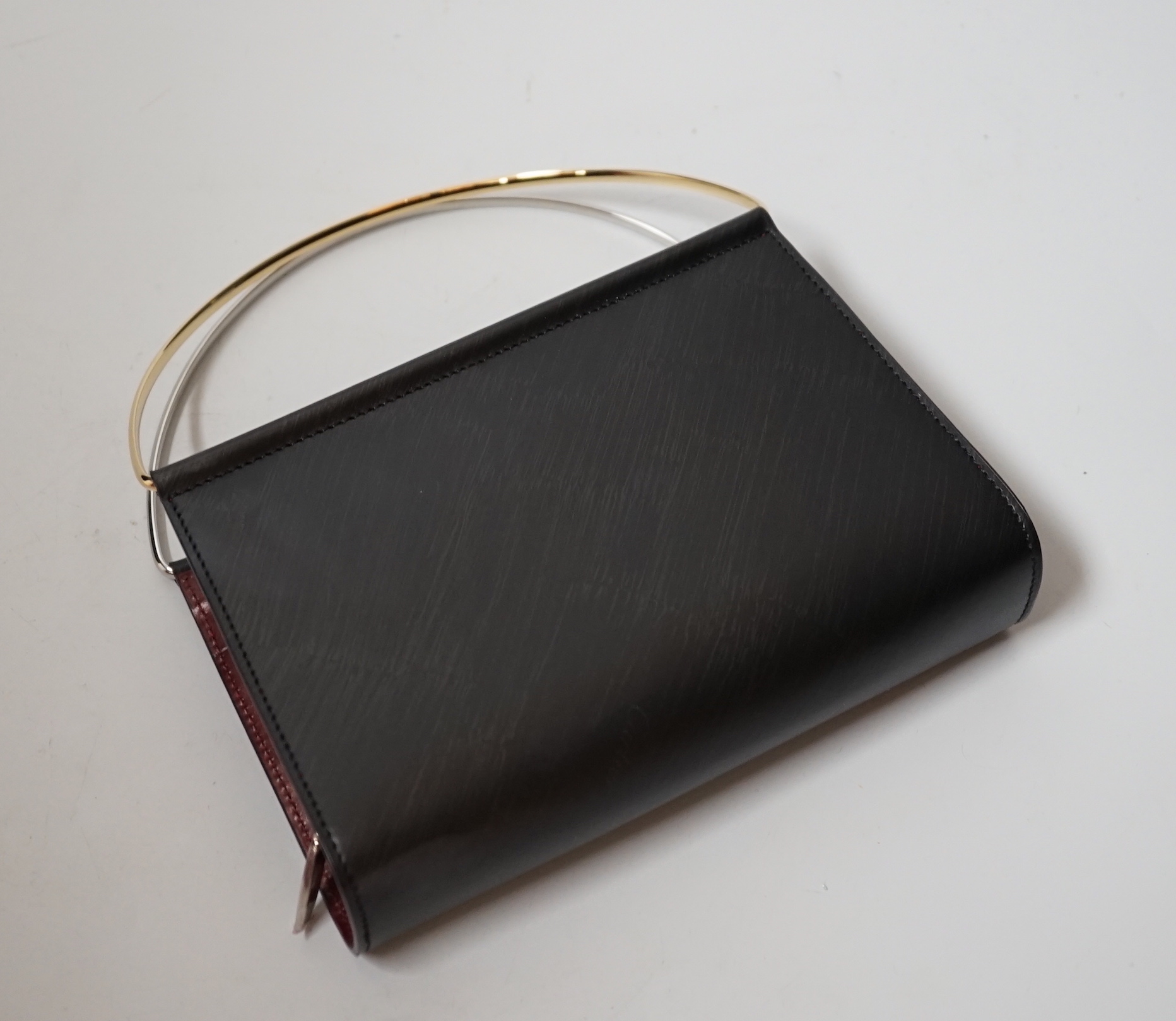 A small Cartier lady’s leather evening bag, 16cm wide, with original box