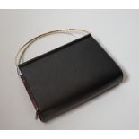A small Cartier lady’s leather evening bag, 16cm wide, with original box