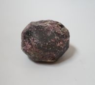 An unpolished and uncut garnet boulder, approx. 6cm.