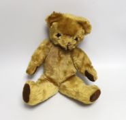 A mid 20th century teddy bear, probably Merrythought, 37cm high