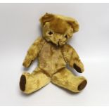 A mid 20th century teddy bear, probably Merrythought, 37cm high