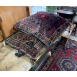 Two Afghan carpet cushions, larger 110 x 68cm