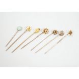 Three early 20th century 15ct stick pins including gem, three similar 9ct stick pins and one other