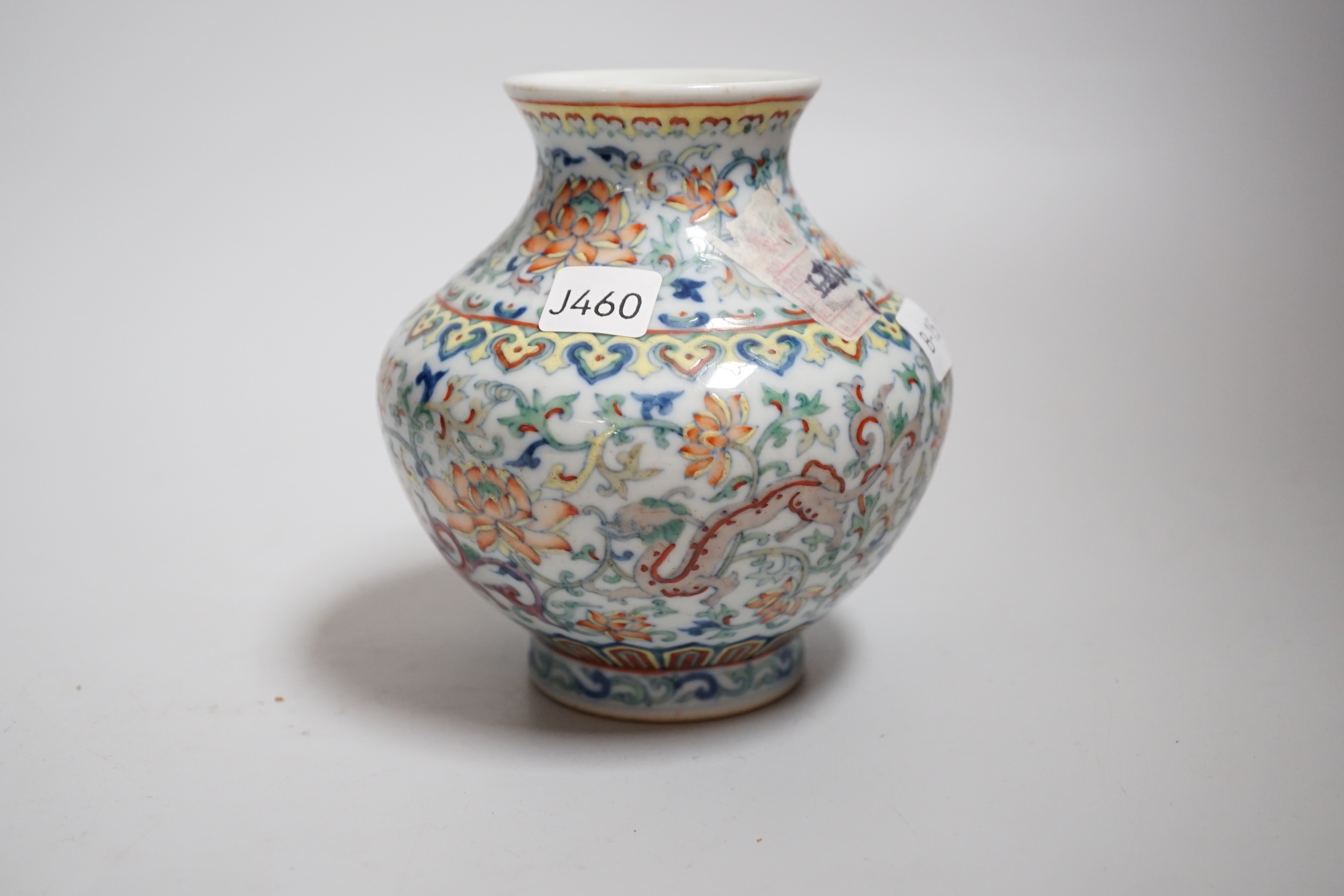 A small Chinese doucai jar, decorated with dragons and lotus flowers, housed in a fitted case, 12. - Image 3 of 4