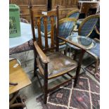 An Art Nouveau inlaid oak elbow chair, width 60cm, depth 52cm, height 114cm