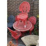 A Victorian style circular painted aluminium garden table, diameter 80cm, height 68cm and four