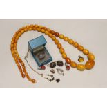 A single strand graduated oval amber bead necklace, 98cm, gross weight 94 grams and other sundry