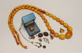 A single strand graduated oval amber bead necklace, 98cm, gross weight 94 grams and other sundry