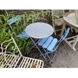 A circular metal folding garden table, diameter 60cm, height 70cm and two chairs