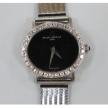 A lady's Baume & Mercier 750 white metal and diamond set manual wind dress wrist watch, with black