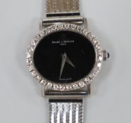 A lady's Baume & Mercier 750 white metal and diamond set manual wind dress wrist watch, with black