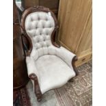 A Victorian style faux suede mahogany spoon back armchair, width 70cm, depth 82cm, height 100cm