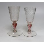 Two similar 18th century Continental goblets, both with elongated bowls heavily engraved with