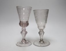 Two 18th century Dutch wine goblets with wheel engraved decoration, one inscribed, the largest