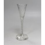 An 18th century-style mixed twist wine glass, drawn trumpet of two piece form in soda metal, with