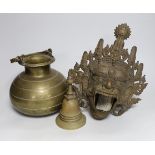 A Tibetan bronze Mahakala mask censer, a stupa shaped bell and a Ceylonese Lota bronze vessel,