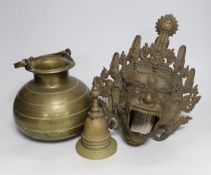A Tibetan bronze Mahakala mask censer, a stupa shaped bell and a Ceylonese Lota bronze vessel,