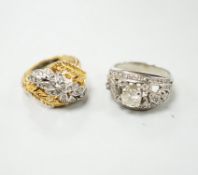 A mid 20th century white metal and single stone diamond set dress ring with diamond chip setting,
