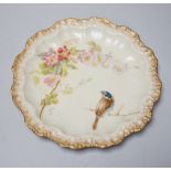 A Limoges dessert service decorated with birds and flowers, the largest 27cm wide