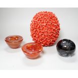 An orange pottery organic design vase, a pair of orange Kosta Boda glass candle holders and a grey