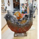 A large art glass textured centrepiece on stand, with amber orange and black matt over glazing 49 cm