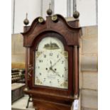 A late 18th century mahogany banded oak eight day longcase clock, with an arched painted dial marked