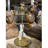 An early 20th century brass parrot on perch two light candelabrum, 33cm high
