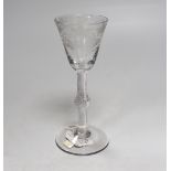 A fine English lead crystal air twist wine glass, c.1740, round funnel bowl with fruiting vine