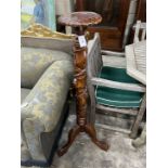 A Victorian style mahogany carved torchere stand, height 116cm