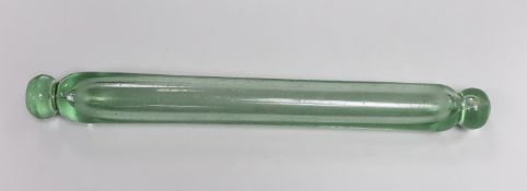 A Georgian glass rolling pin, pontils to either end, one polished, 48.25cm long
