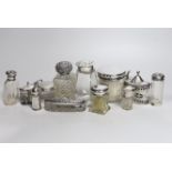 Nine assorted silver mounted glass toilet jars, two mustard pots including largest, London, 1882 and