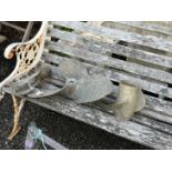 Two vintage brass ship's propellers and an oar rowlock, largest 42cm