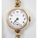 A lady's 1960's? 9ct gold manual wind wrist watch, with Arabic dial and subsidiary seconds, on