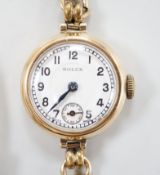 A lady's 1960's? 9ct gold manual wind wrist watch, with Arabic dial and subsidiary seconds, on
