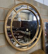A Victorian style circular gilt composition marginal plate wall mirror, diameter 111cm
