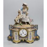 A mid-19th French century porcelain figural mantel clock, the enamel dial inscribed Rollin Paris,