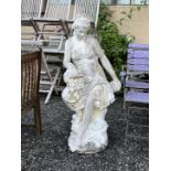A large reconstituted stone garden statue of a female flower seller, height 120cm