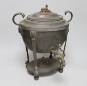 A 19th century Egyptian-revival copper tea urn with sphinx knop, Greek key borders and twin handles,